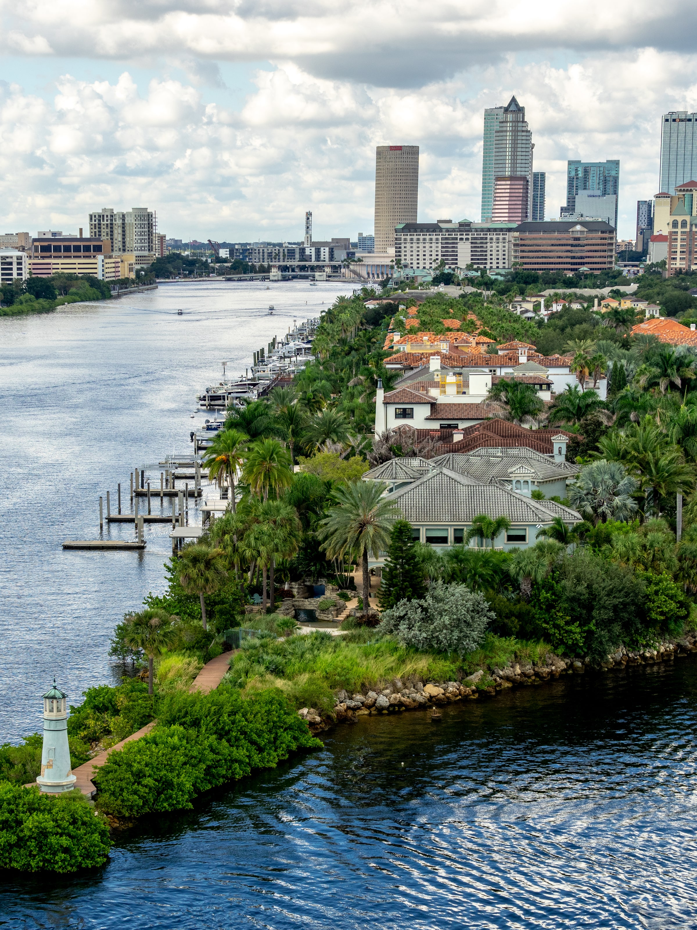 Downtown Tampa skyline rising behind waterfront Tampa Bay homes